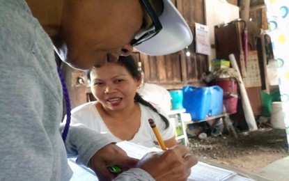 <p><strong>UCT BENEFICIARY. </strong>A resident of Palawan gets validated by DSWD's Listahanan. <em>(File photo by DSWD Mimaropa)</em></p>